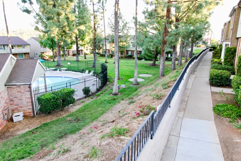 In Royal Gardens has swimming pools with plants, trees
