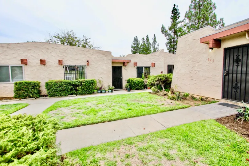 Residential units with grass and sidewalks at Scranton Palisades in El Cajon California