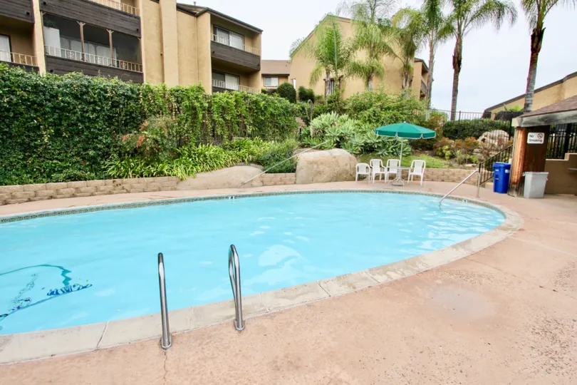 A BEAUTIFUL SWIMMING POOL WITH FULL OF WATER IN A VILLA