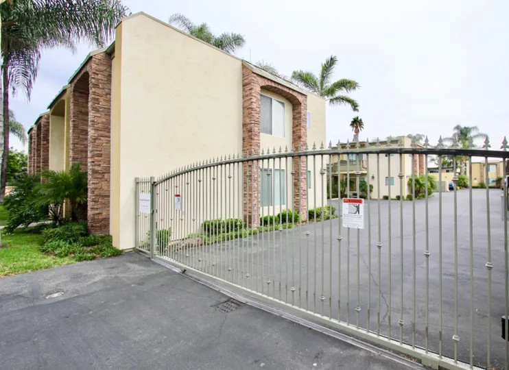 Side view of a residence and parking gate of Sun Ridge, a residential community located in El Cajon, CA