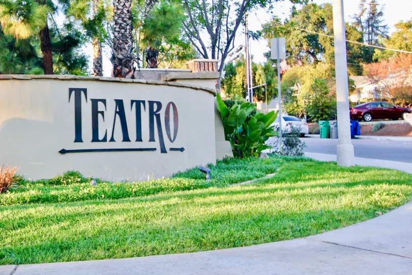 Community sign surrounded by trees at Teatro in El Cajon California