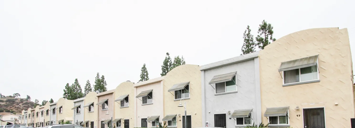 Long line of units both clay color and white in the community the Galleria.
