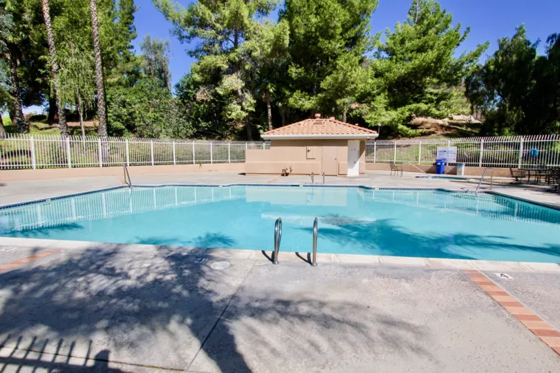 Outer view of pool area in The Knolls with view of swimming pool.