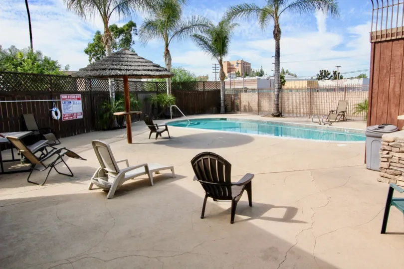 A BEAUTIFUL SWIMMING POOL WITH FULL OF WATER IN A VILLA