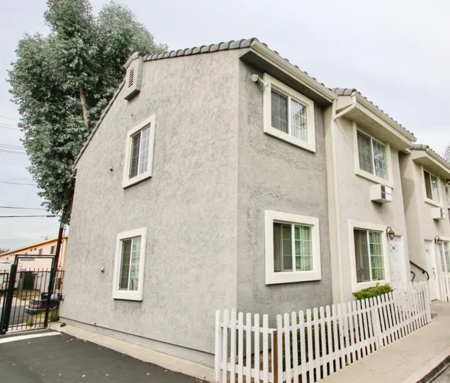 Two story housing next to tree at Valley view in El Cajon California