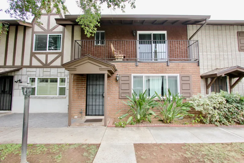 Two story residence near sidewalk at Villa Del Rhine in El Cajon Caliornia
