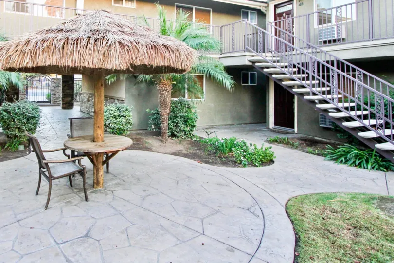A BEAUTIFUL HOUSE AND A NICE FURNITURE IN FRONT OF THE HOUSE