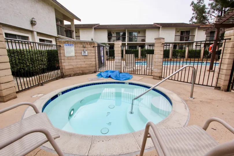 A view of a luscious gated Jacuzzi available to residents in Villa Madera in El Cajon