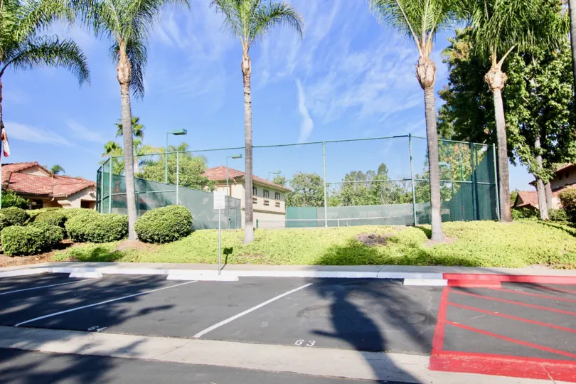 Tennis court near residential units at Villa Montevina in El Cajon California