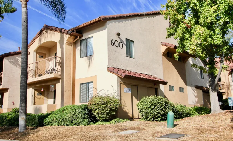 A sunny day in Villa MOntevina has plot number 600 with trees and bushes