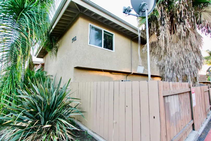 Two story housing with wooden fence at Villa Toscano in El Cajon California