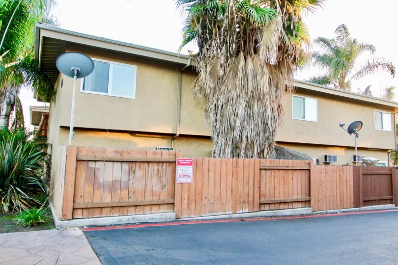 Two story apartments with wooden fence at Villa Toscano in El Cajon California