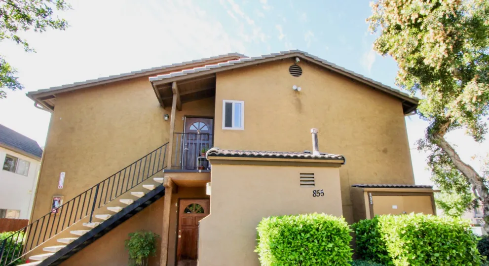 Two story housing with attached stairway at Villas at Lexington in El Cajon California