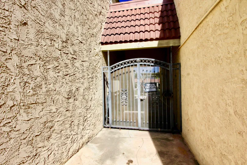 A sunny front view of the entrance gate to Washington Heights community in El Cajon, California.