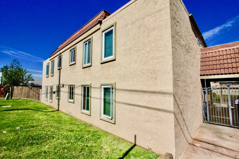 Two story housing with green yard at Washington Heights in El Cajon California