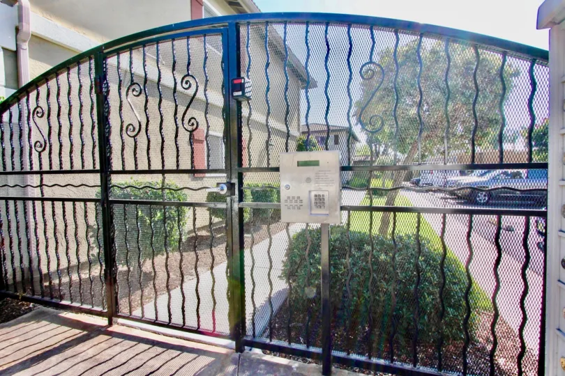 Metal security gate with keypad at Woodland Village in El Cajon California