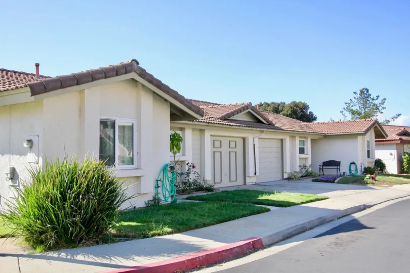 Large one story home on the side of the road with one garage, located in Avocado Estates, Escondido, California.