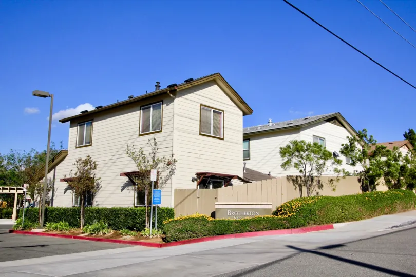 Two story townhomes with fence at Brotherton Square in Escondido California