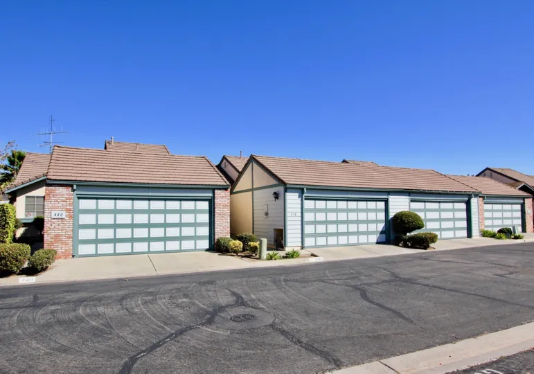 Two garage structures along a driveway located at Cape Concord in Escondido CA