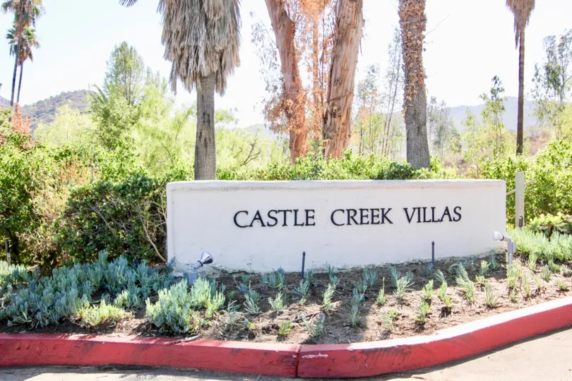 Community sign near entrance at Castle Creek Villas in Escondido California