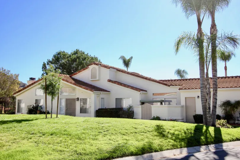the rear view of a house in Castle Creek Villas in Escondido California on a sunny day