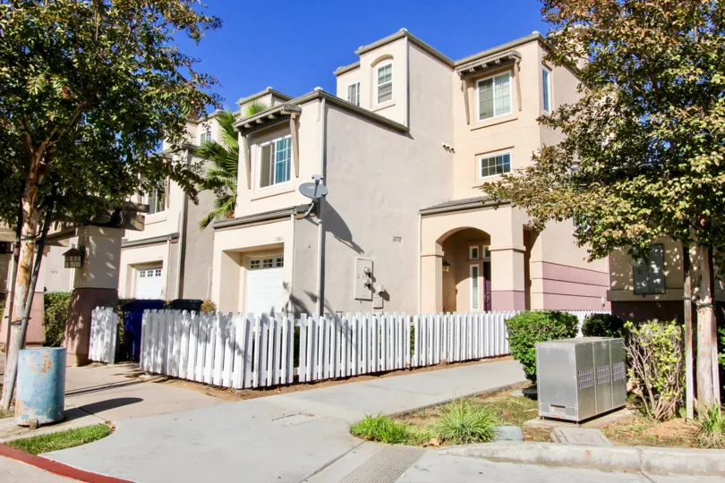 a large residence looking building with garages in front in Escondido Park Row.