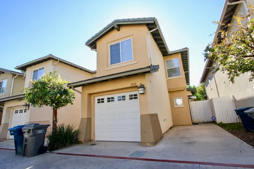 Escondido Park Row community Escondido California garage windows tree fence landscaping gutters