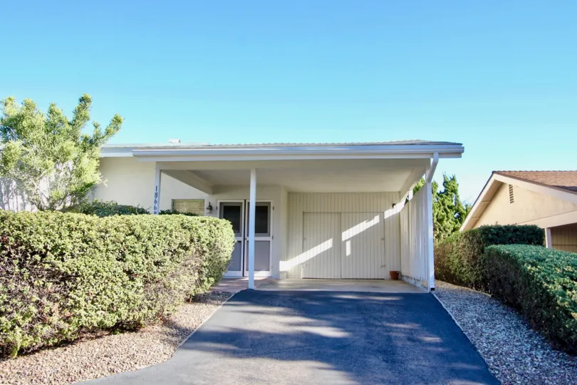 Carport, garage, driveway and entrance for single level home in Fairway Park. Located in Escondido California.