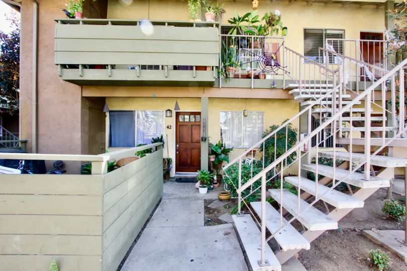 Sturdy and beautiful Brown doors next to staircase to second floor.