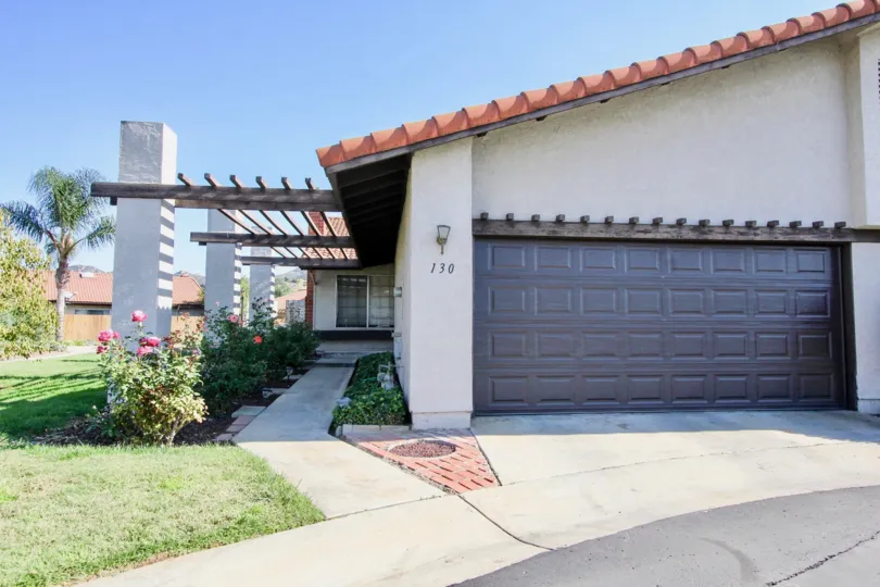 A view of a sidwalk and a garage door in Heather Glen community