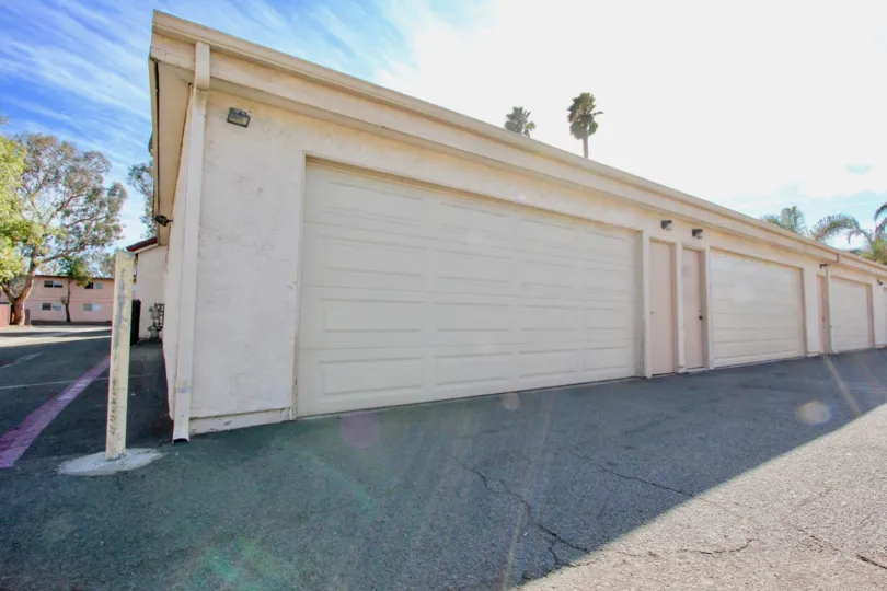 Attached double car garages and a wide backlane with adjacent parking stalls at Martin Court Gardens