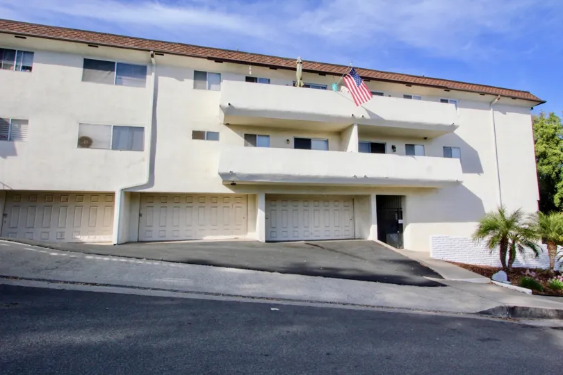A United States Flag waves off a second floor balcony in Montecristo Villas South