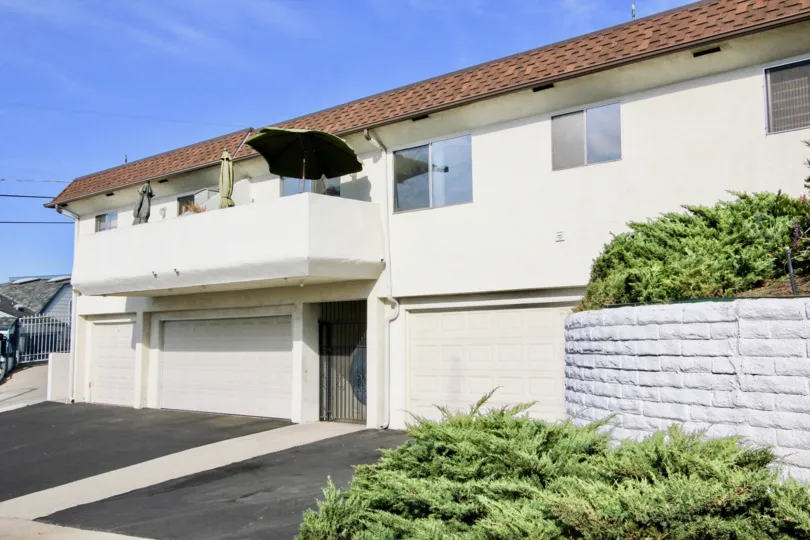 Two story residential buildings with attached garages at Montecristo Villas South in Escondido California