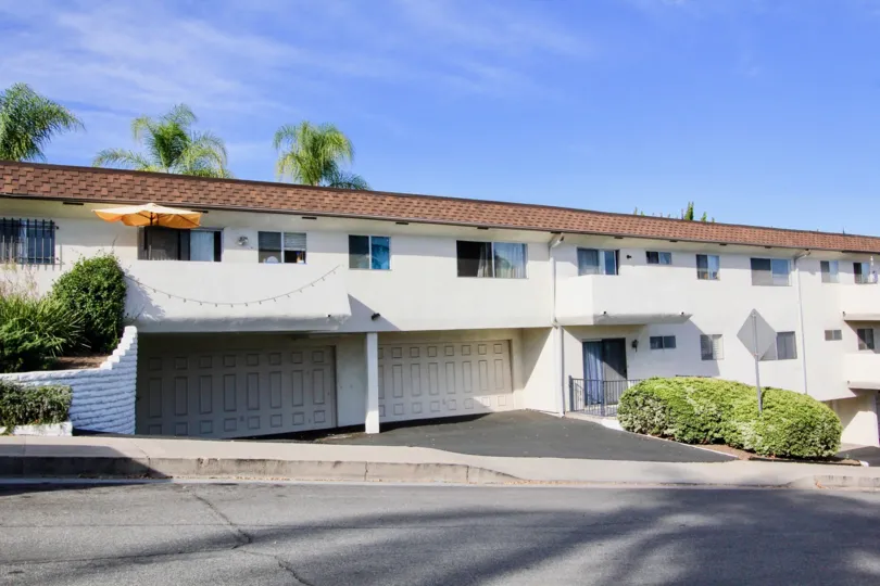 Two story residential buiding with build in garages at Montecristo Villas South in Escondido California