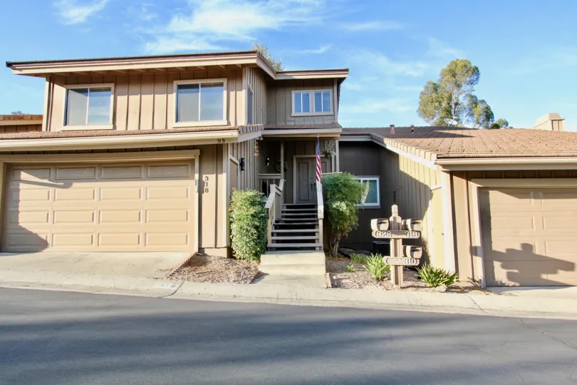 Morningside Woods community Escondido California garage stairs covered entry spli level windows shrubs mailboxes landscaping off street parking