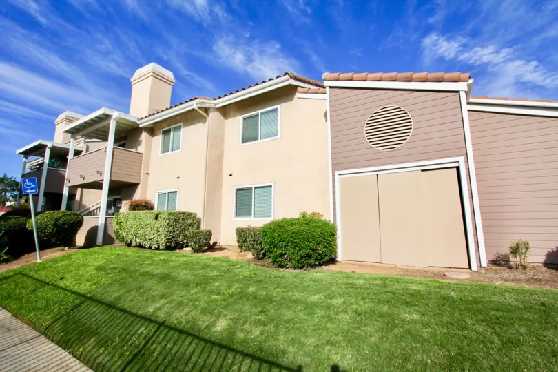A Board sign is placed upon the meadow opposed to the Villa's in Mountain View Villas