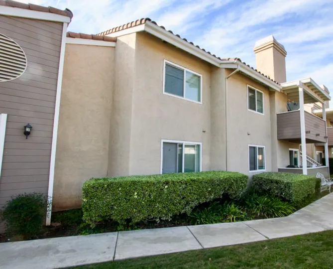Mountain View Villas community Escondido California sidewalk hedges landscaping windows balcony tile roof chimney balcony stairs