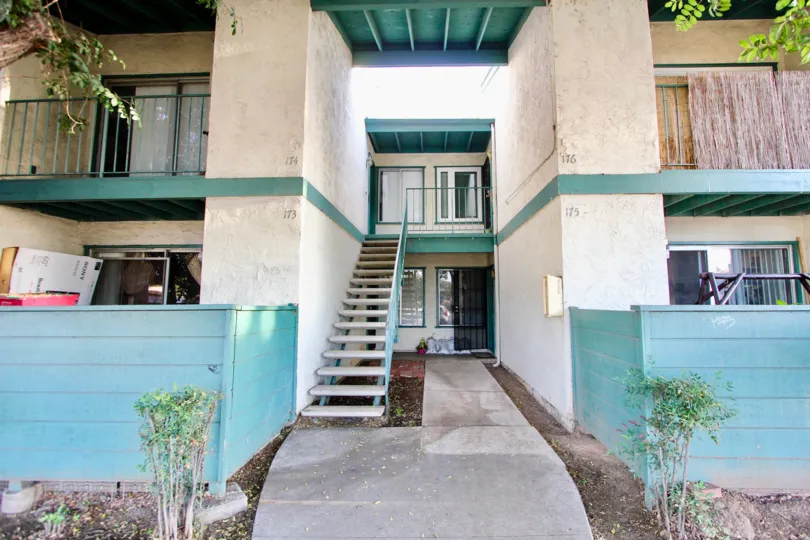 Two story residential building with attached stairway at Pepperwood Meadows in Escondido California