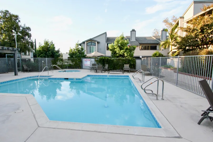 Swimming pool surrounded by residential buildings at Quarry Glen in Escondido Califonia