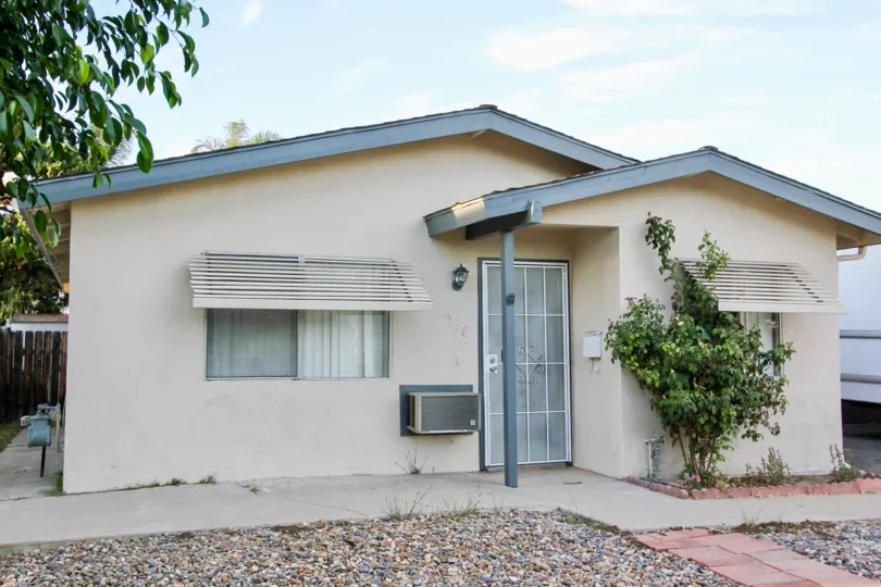 Small home with small tree an window AC at Rosedale Manor in Escondido California