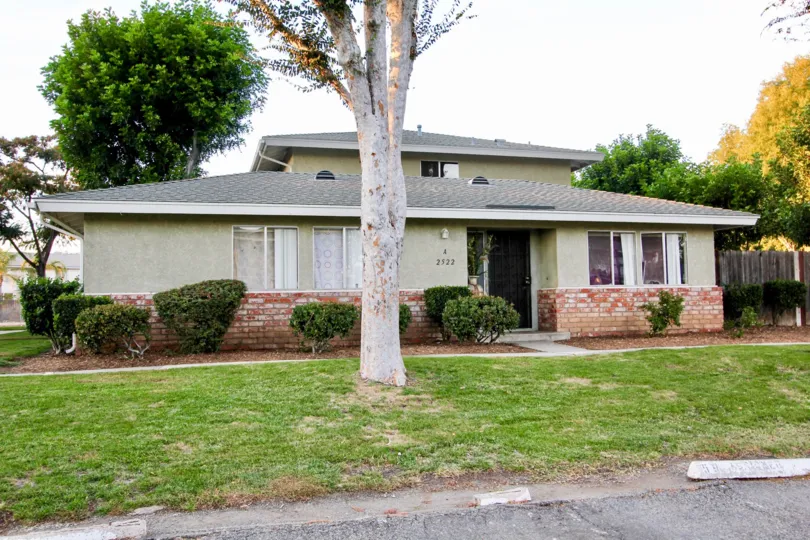 Two story home with green yard and trees at Shadow Mountain in Escondido California