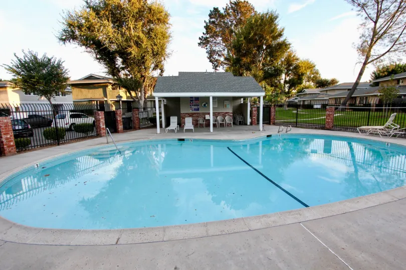 Shadow Mountain community Escondido California pool covered seating lounge chairs fence parking trees grass landscaping