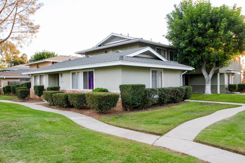 A house with grey tiled roof in a greeny setting at Shadow Mountain.