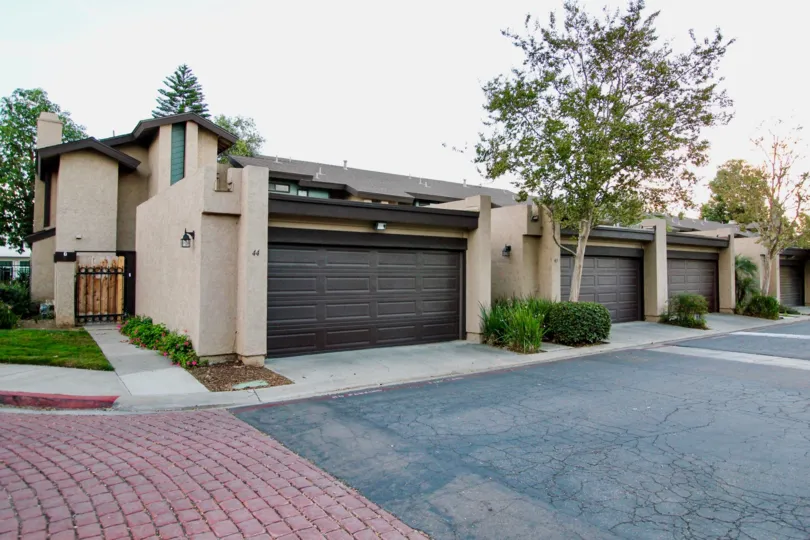 Driveway and housing with attached garages at Skylark Terrace in Escondido California