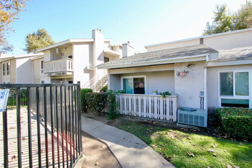 A sunny day with multiple homes with balconies in Sun Mountain Springs