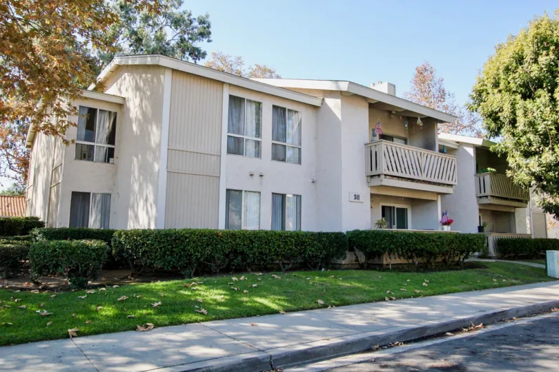 A long narrow yard under huge trees at Sun Mountain Springs in Escondido CA