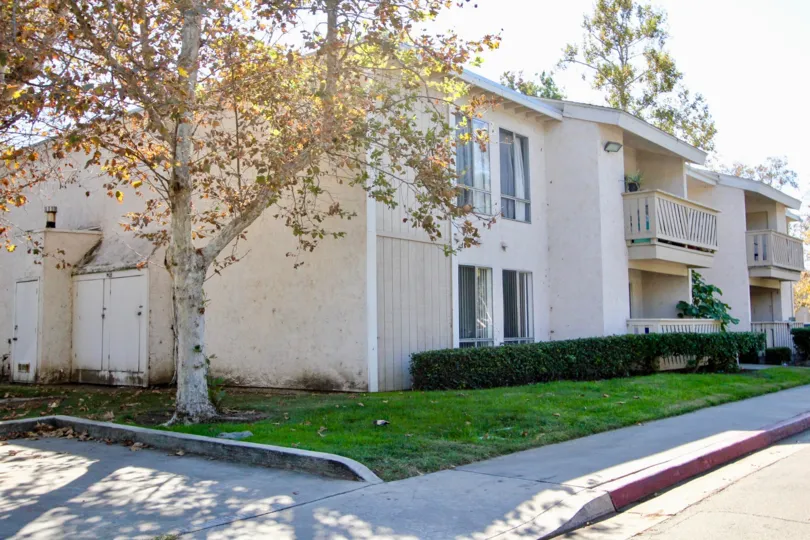 Two story housing building surrounded by grass at Sun Mountain Springs in Escondido California