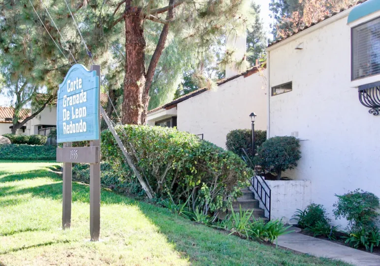 A sign for the frront of Corte Granaa de Leon Redondo at Sunset Woods.