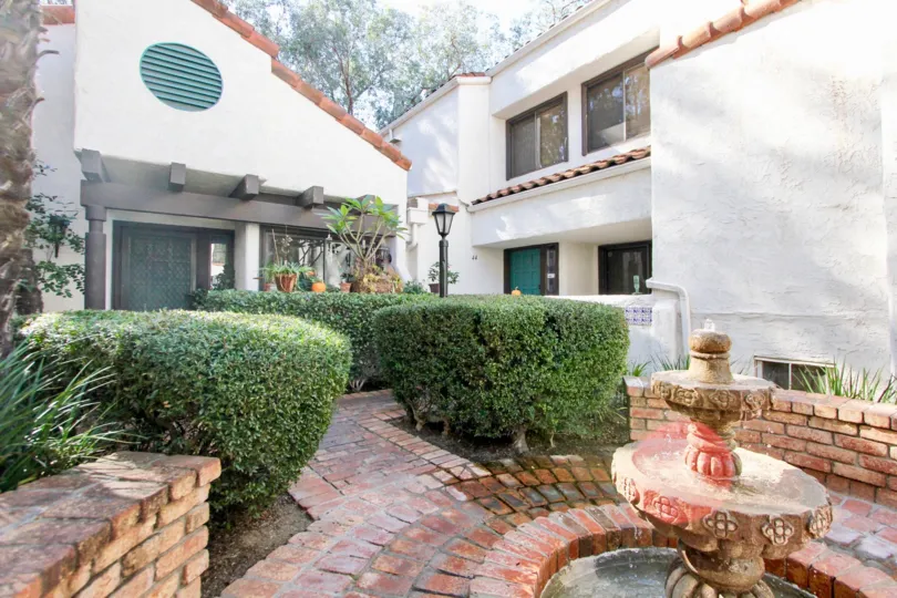 Sunset Woods, Escondido , California, trimmed bushes, fountain