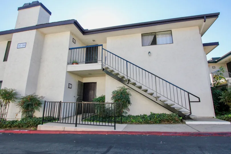 Two story housing with attached stairway at Vermont Villas in Escondido California